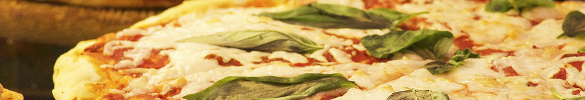 Eating Greek Italian Pizza at Primavera Pizzeria & Grill restaurant in Fredericksburg, VA.